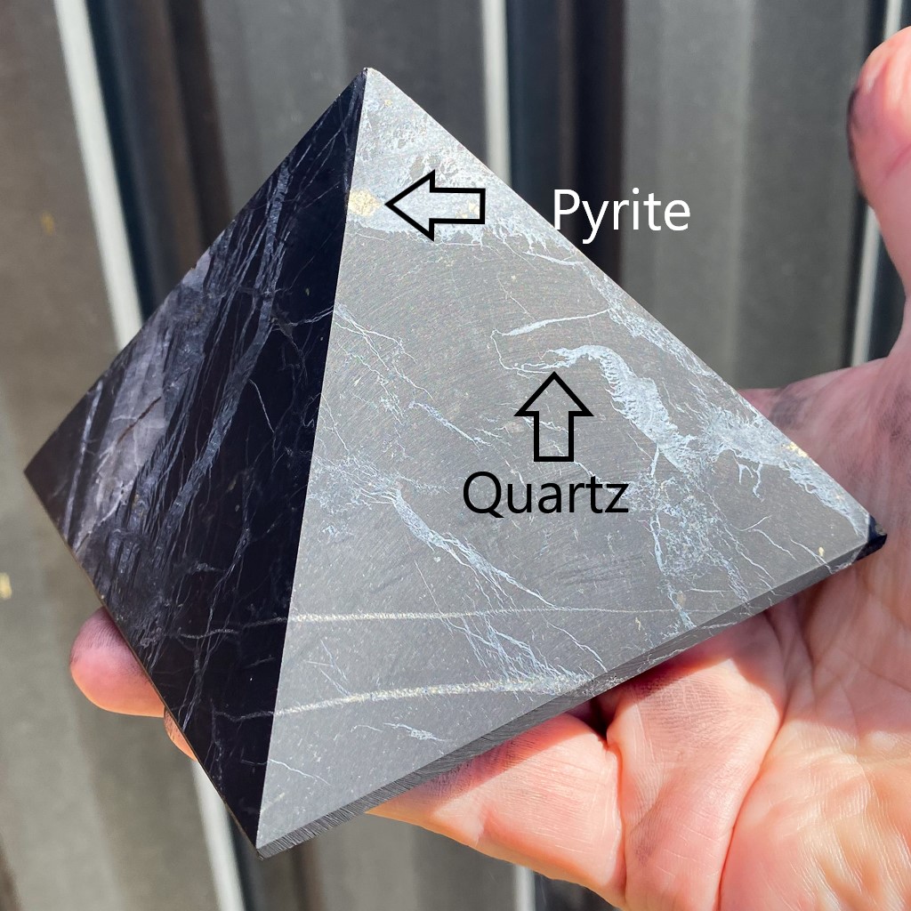 Shungite pyramid with quartz and pyrite