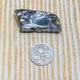 Small piece of Elite Shungite next to 5 cent coin