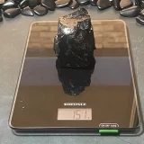 151 gram piece of Elite Shungite on a scale