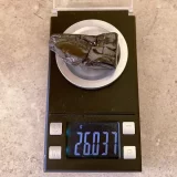 Piece of Elite Shungite 26 grams on a scale
