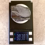 Piece of Elite Shungite 30 grams on a scale
