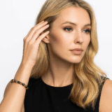 Create a product photo of blonde model wearing the bracelet on her left wrist