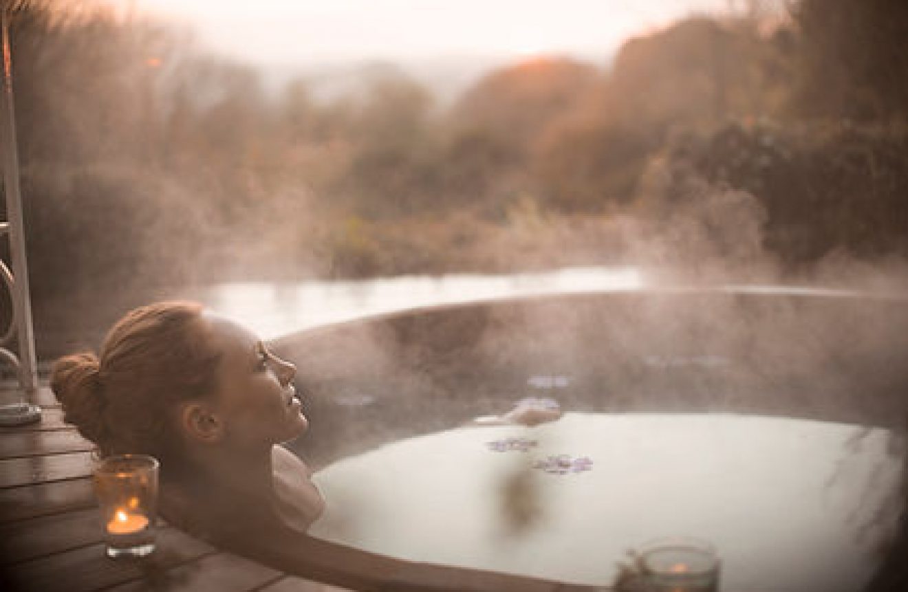 Woman relaxing in hot tub